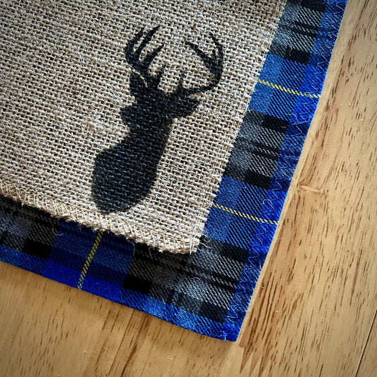 Blue tartan placemats with stag