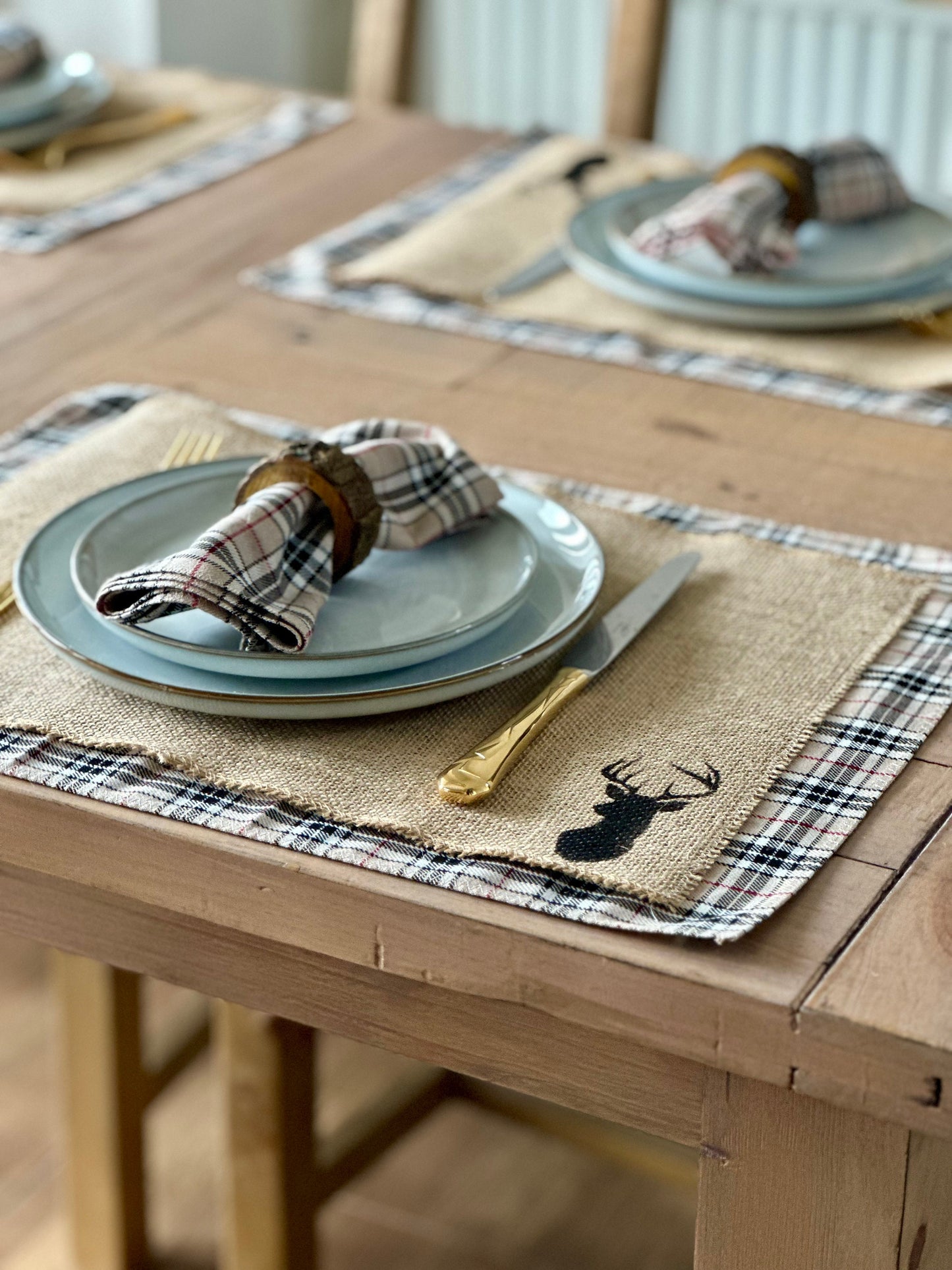 Neutral tartan placemats with stag