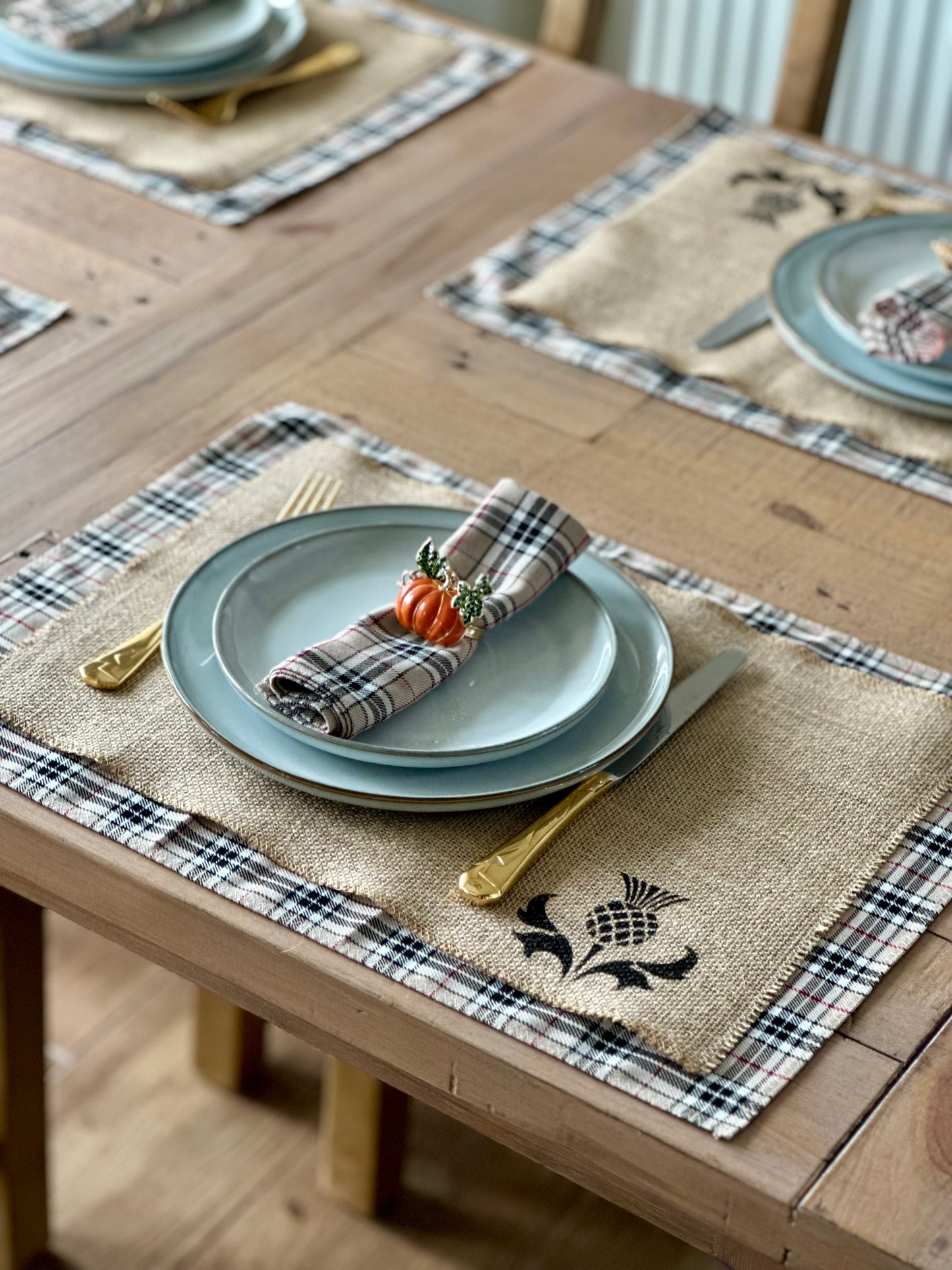 Neutral tartan placemats with thistle