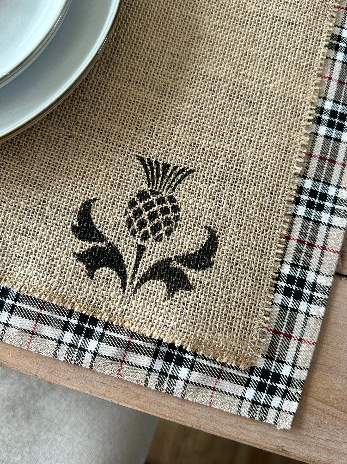 Neutral tartan placemats with thistle