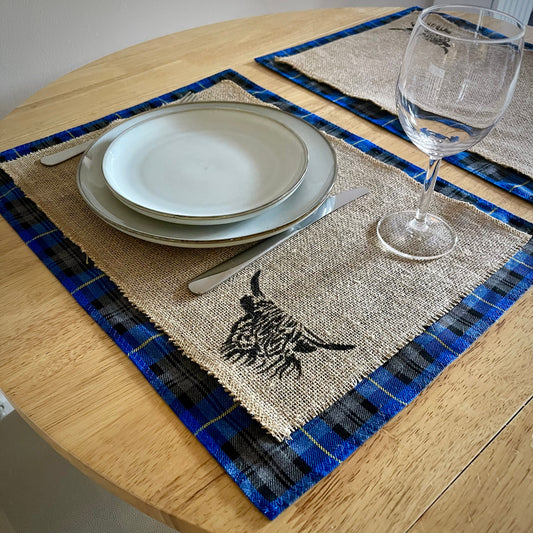 Blue tartan placemats with highland cow