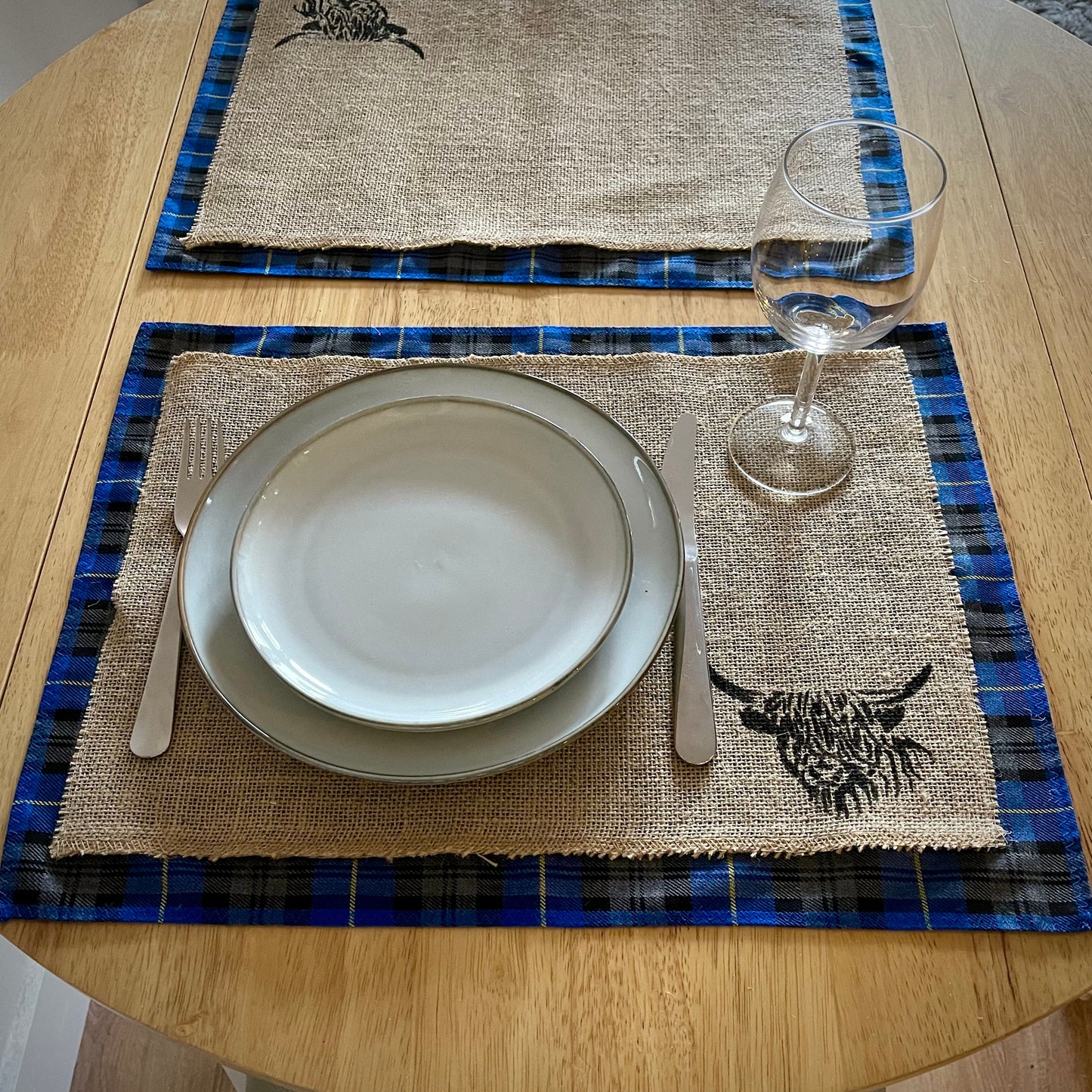 Blue tartan placemats with highland cow