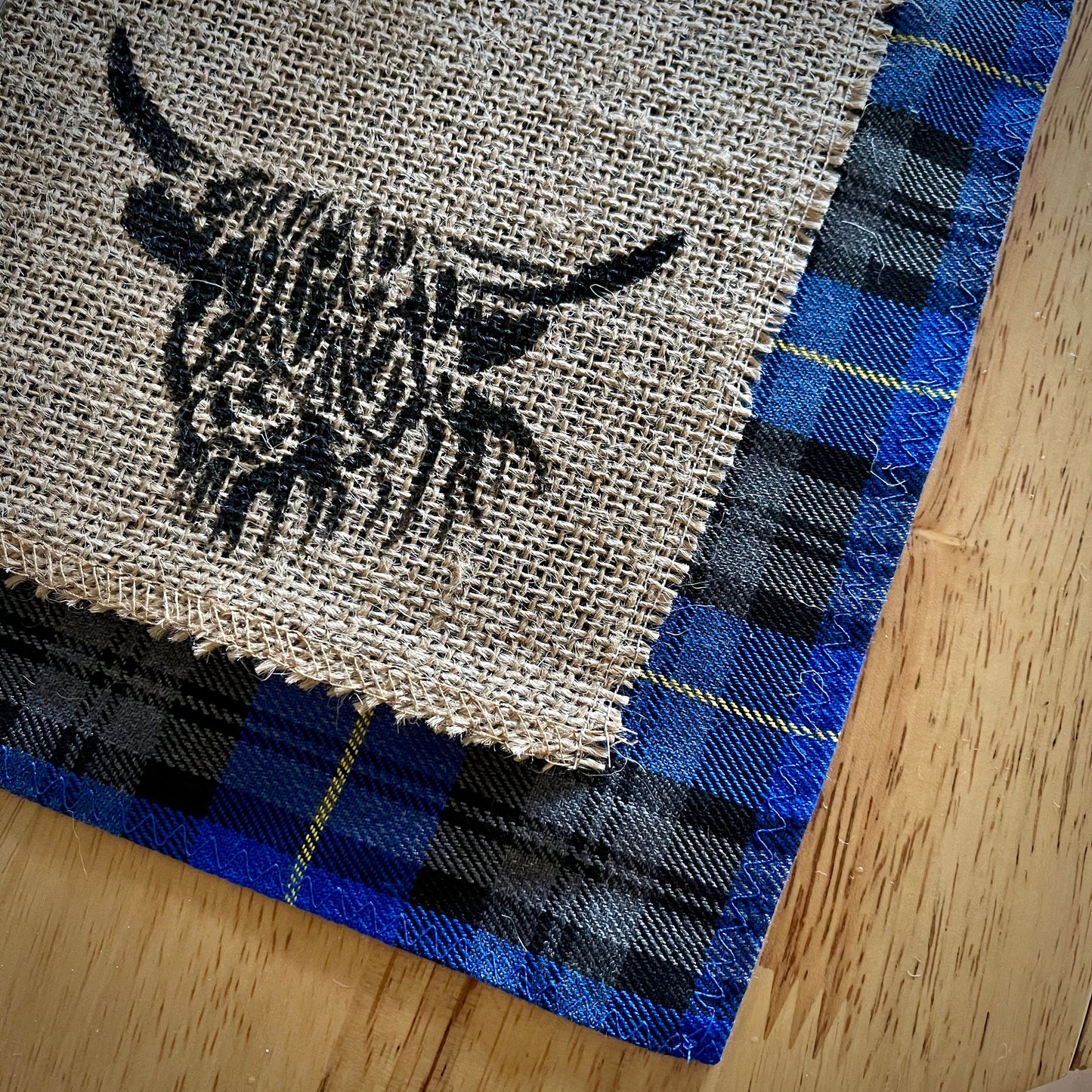 Blue tartan placemats with highland cow