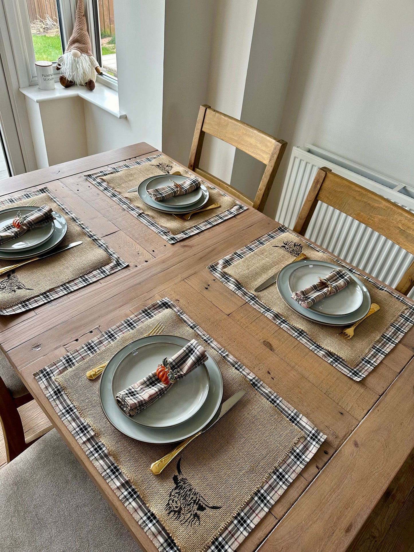 Neutral tartan placemats with highland cow